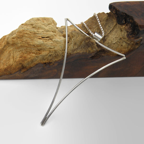 Large Negative Space Triangle Pendant