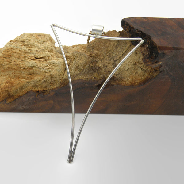 Large Negative Space Triangle Pendant